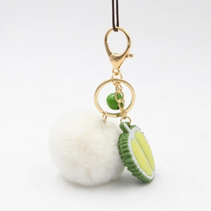 Durian fruit keychain with white plush ball and gold lobster clasp for bags