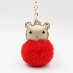 Porte-clés ours mignon avec pompon rouge, couronne dorée et clip métallique