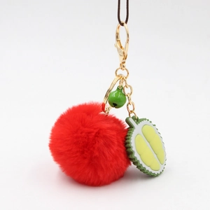 Durian fruit keychain with fluffy red pompom, green bell and golden lobster clasp