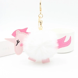 Plush unicorn faux fur ball keychain with pink faux leather details and golden hook