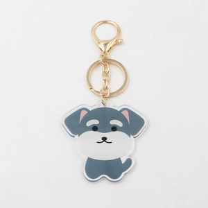 Detailed close-up of a cute acrylic schnauzer keychain with a gold lobster clasp