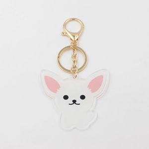 Detail of a white acrylic Chihuahua keychain with pink ears and golden lobster clasp hardware