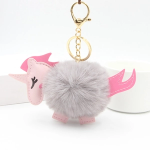 Plush unicorn faux fur keychain with pink leather accents and gold metal ring