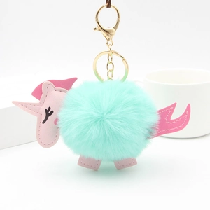 Unicorn faux fur keychain with mint green plush ball and pink leather details