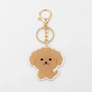 Close-up of cute acrylic teddy dog keychain with high-quality golden metal lobster clasp