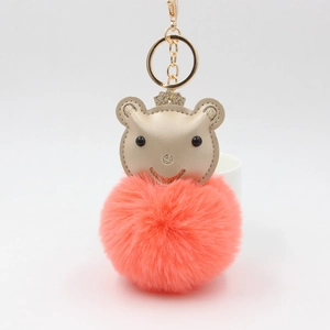 Porte-clés ours princesse en peluche avec pompon rose et couronne dorée sur blanc