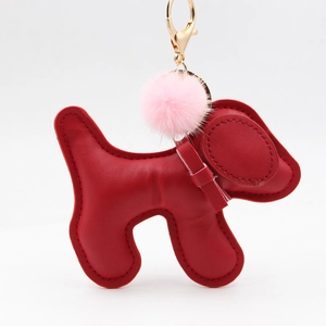 Cute red faux leather puppy keychain with pink fur ball and golden spring clasp