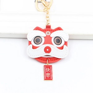 Chinese red leather lion dance keychain with golden happy tag for bag decoration
