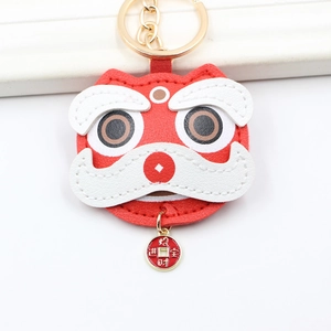 Red leather lion dance keychain with gold lucky coin charm and metal keyring
