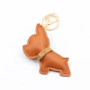Detailed close-up of brown PU leather bulldog keychain with gold ring and lobster clasp