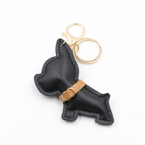 Cute black leather cartoon bulldog keychain with gold lobster clasp and brown collar detail