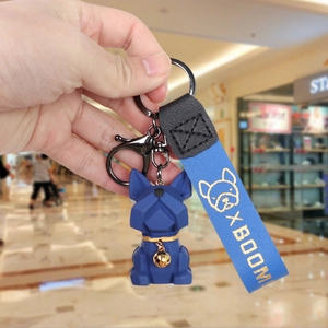 Deep blue geometric bulldog keychain with leather wristband and gold bell accessory