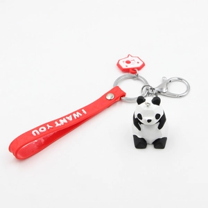 Cute geometric 3D panda keychain with red silicone wristlet and silver metal lobster clasp