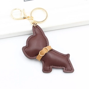 Detailed view of deep brown leather French Bulldog keychain with gold metal lobster clasp