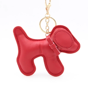 Detail of red faux leather dog pendant with gold lobster clasp and fine stitching