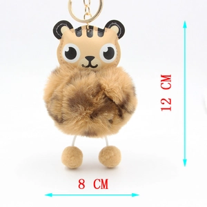 Detail view of a cute tiger plush keychain with dimensions 12 cm height and 8 cm width