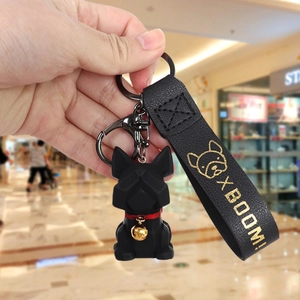 Cartoon resin French Bulldog keychain with black leather strap and golden bell detail
