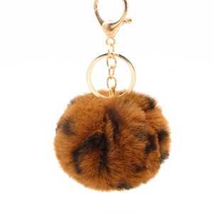 Leopard print faux fur pompom keychain with golden metal hardware and lobster clasp