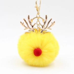 Christmas reindeer plush pompom keychain with yellow fur and golden metallic antlers