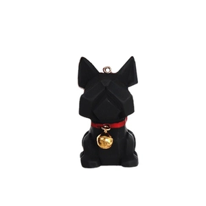 Detailed close-up of a black low-poly bulldog charm with a red collar and gold bell decoration