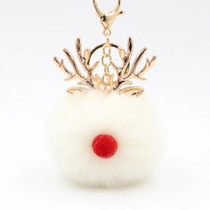 Detail of Christmas reindeer plush ball keychain with rose gold antlers and metal ring