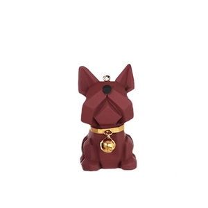 Macro detail of a faceted resin bulldog figurine with a golden collar and bell
