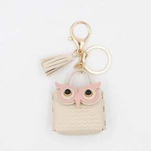 Mini owl PU leather keychain wallet with golden tassel and lobster clasp on white background