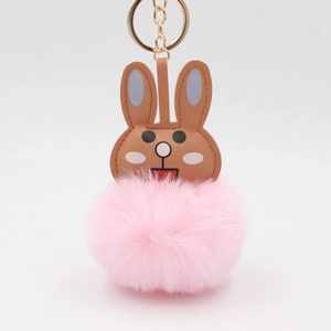 Porte-clés lapin mignon avec tête en cuir marron et pompon en fourrure rose douce
