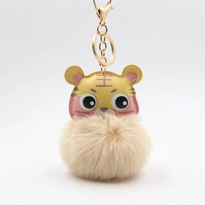 Porte-clés tigre en cuir PU avec pompon beige et fermoir métallique doré chic