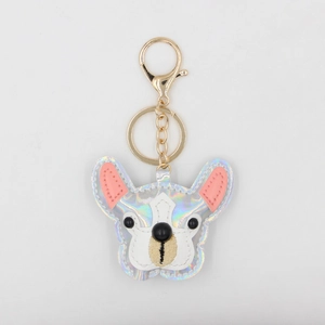 Detailed macro view of French Bulldog keychain with colorful laser leather and gold clasp