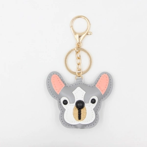 Detail of grey PU leather French Bulldog keychain with gold metal clasp and stitching