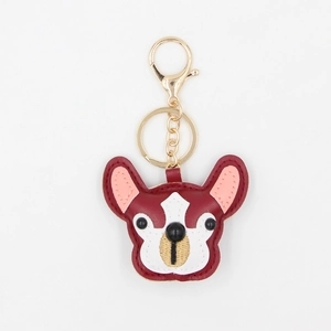 Detail view of burgundy PU leather French bulldog keychain with golden metal hook