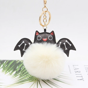 Cute Halloween bat pompom keychain with white faux fur ball and black leather wings