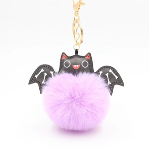 Halloween purple faux fur bat keychain with golden clasp and black leather wings