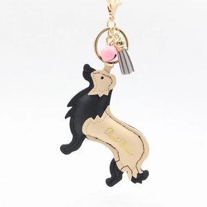 Cartoon golden retriever leather keychain with pink bell and grey tassel for bags