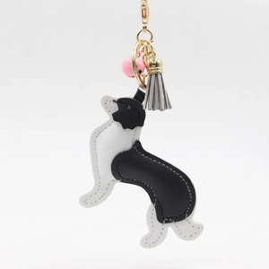 Cute black and white border collie PU leather keychain with pink bell and grey tassel