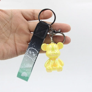 Chic iridescent yellow resin bear keychain with a stylish black fashion braided wrist strap