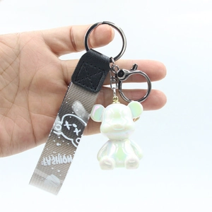 Pearlescent white bear keychain with metal hook and fashion woven strap for bags