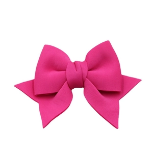 Elegant rose red fabric bow accessory for shoes and bags on a clean white background