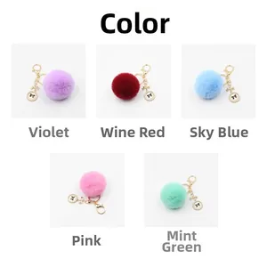 Detail of colorful faux fur pompom keychains with bow and butterfly charm accents