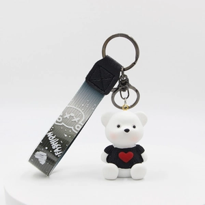Cartoon teddy bear keychain with heart sweater and gradient fashion ribbon on white back