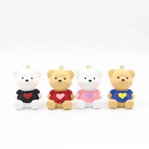 Set of four gradient heart bear keychains with knitted sweaters in multiple colors