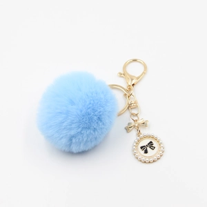 Light blue faux fur pompom keychain with golden bow and pearl charm for bags