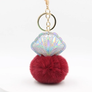 Laser PU shell and burgundy faux fur pompom keychain with golden metal clasp