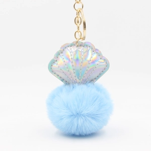 Laser shell keychain with light blue plush fur ball and golden metal ring for bags