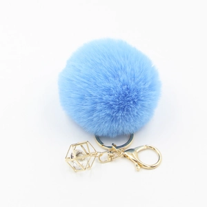 Light blue faux fur pompom keychain with golden geometric crystal pendant and alloy ring