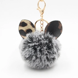 Creative plush pompom keychain with leopard ears and gold metal clasp for bag decor