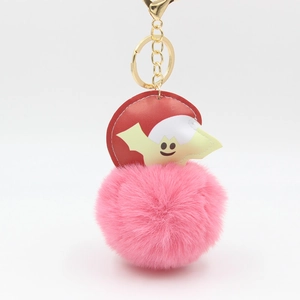 Halloween pom pom keychain featuring a pink faux fur ball with a cute bat decoration