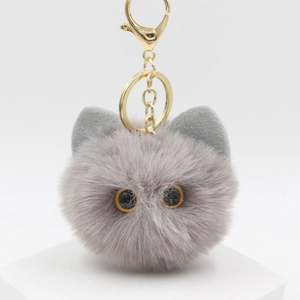 Detailed close-up of a grey plush cat head keychain with gold alloy lobster clasp