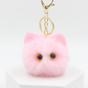 Pink plush cat ear keychain with soft fur texture and gold metal lobster clasp